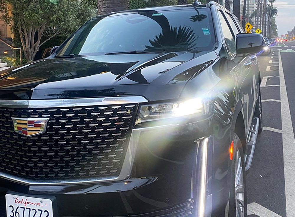 1st Choice Cadillac Escalade under palm trees