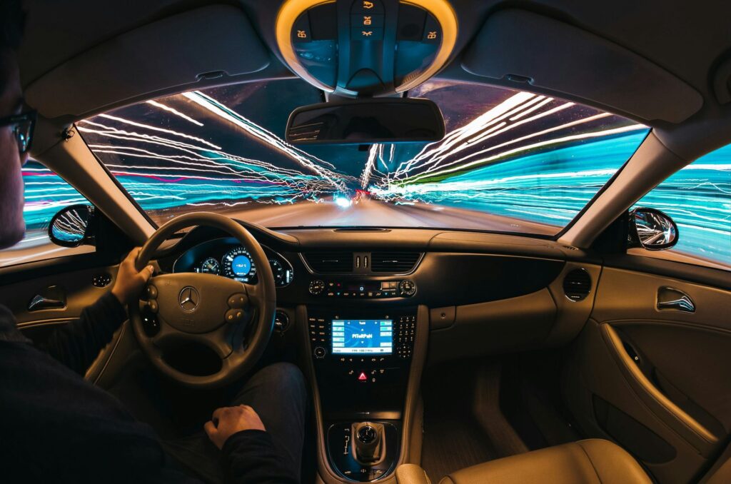 Luxury car dashboard lit at night