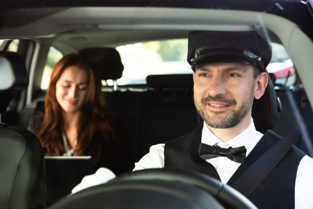 Business traveler riding with a professional chauffeur